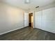 Cozy bedroom featuring hardwood floors, a spacious closet, and an open doorway at 404 Water St, Plant City, FL 33563