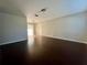 Spacious living room with hardwood floors and sliding glass doors leading to the outdoors at 404 Water St, Plant City, FL 33563