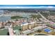 Aerial view features building within the waterfront community, tennis courts and lakes for recreation at 4725 Cove Circle # 908, St Petersburg, FL 33708