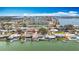 An aerial shot shows waterfront homes and condos with boat docks and waterway access at 4725 Cove Circle # 908, St Petersburg, FL 33708