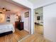 Bedroom featuring hardwood floors and a glimpse into the living room at 4725 Cove Circle # 908, St Petersburg, FL 33708