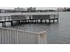 Community dock area with benches offering picturesque waterfront views for relaxation and enjoyment at 4725 Cove Circle # 908, St Petersburg, FL 33708