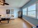 Relaxing living room with hardwood floors, comfortable sofa, and beautiful views of the water at 4725 Cove Circle # 908, St Petersburg, FL 33708