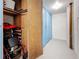 Storage room with shelving and lockers containing personal items and a walker for accessibility at 4725 Cove Circle # 908, St Petersburg, FL 33708