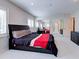Bright bedroom features mirrored closet doors, sleek furnishings and plush carpet at 504 Riverside Dr # 504, Tarpon Springs, FL 34689