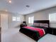 Bright bedroom features mirrored closet doors, sleek furnishings and plush carpet at 504 Riverside Dr # 504, Tarpon Springs, FL 34689