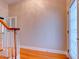 Foyer with hardwood floors, baseboard trim, and a decorative front door at 504 Riverside Dr # 504, Tarpon Springs, FL 34689