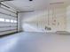 Bright garage with a large windowed door and white walls provides ample storage and workspace at 504 Riverside Dr # 504, Tarpon Springs, FL 34689