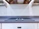 Close up of flat top electric range with a stainless steel hood at 504 Riverside Dr # 504, Tarpon Springs, FL 34689