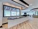 Open concept kitchen featuring granite countertops and views to the living area and backyard at 504 Riverside Dr # 504, Tarpon Springs, FL 34689