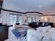 Bright living room features modern furniture, stylish blue rug, and natural light from multiple windows at 504 Riverside Dr # 504, Tarpon Springs, FL 34689