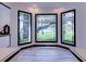 Bright living room featuring a set of windows offering a view of the outdoors at 504 Riverside Dr # 504, Tarpon Springs, FL 34689