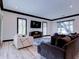 Bright living room features modern furniture, stylish blue rug, and natural light from multiple windows at 504 Riverside Dr # 504, Tarpon Springs, FL 34689