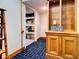 Storage area with wooden cabinet and shelving and doorway entrance, perfect for organization at 504 Riverside Dr # 504, Tarpon Springs, FL 34689