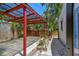 The backyard includes a covered patio, ideal for outdoor dining, with mature landscaping around the property's perimeter at 601 75Th St N, St Petersburg, FL 33710