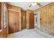 Bedroom features paneled walls, neutral carpet, and a large closet space at 601 75Th St N, St Petersburg, FL 33710