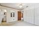 Bedroom features neutral walls, large closet, ceiling fan, and attached bathroom at 601 75Th St N, St Petersburg, FL 33710
