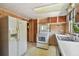 Classic kitchen featuring vintage appliances, wood cabinets, and functional design elements at 601 75Th St N, St Petersburg, FL 33710