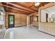 A cozy living room showcases wood-paneled walls, a ceiling fan, and a classic tile floor at 601 75Th St N, St Petersburg, FL 33710