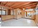 This inviting living room displays an open layout and wood-paneled walls at 601 75Th St N, St Petersburg, FL 33710
