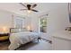 Calm bedroom with ceiling fan, natural light and wood look floors, creating a serene retreat at 642 14Th S Ave, St Petersburg, FL 33701