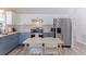 Modern kitchen with butcher block countertops, white subway tile backsplash, and stainless steel appliances at 642 14Th S Ave, St Petersburg, FL 33701