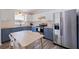 Modern kitchen with butcher block countertops, white subway tile backsplash, and stainless steel appliances at 642 14Th S Ave, St Petersburg, FL 33701