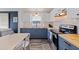 Bright kitchen featuring updated countertops, subway tile, white upper cabinets, and stainless steel appliances at 642 14Th S Ave, St Petersburg, FL 33701