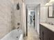 Bathroom featuring a bathtub with tiled walls and a modern vanity at 6700 14Th N St, St Petersburg, FL 33702