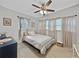 Cozy bedroom with a comfortable bed and ample natural light from multiple windows at 6700 14Th N St, St Petersburg, FL 33702