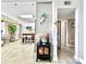Inviting entryway leading to the kitchen with an electric fireplace and unique decorations at 6700 14Th N St, St Petersburg, FL 33702