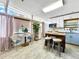 Eat-in kitchen featuring updated cabinets, granite countertops, stainless steel appliances, and a breakfast nook at 6700 14Th N St, St Petersburg, FL 33702