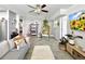 Stylish living room with hanging chair, decorative pillows, and modern furnishings at 6700 14Th N St, St Petersburg, FL 33702