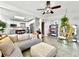 Bright living room featuring an open floor plan with a view into the modern kitchen at 6700 14Th N St, St Petersburg, FL 33702