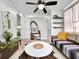 Charming living room with a ceiling fan, white walls, and stylish decor at 6700 14Th N St, St Petersburg, FL 33702