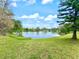 Scenic water view with lush green shoreline and clear blue sky at 6700 14Th N St, St Petersburg, FL 33702
