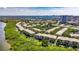 Wonderful aerial view of condo community highlighting landscaping, serene waterways, and surrounding areas at 746 Coral Reef Dr # 746, Tampa, FL 33602