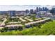 Great aerial view of condo community featuring city skyline, lush greenery, and serene waterways at 746 Coral Reef Dr # 746, Tampa, FL 33602
