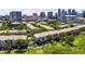 Scenic aerial view of a residential complex with well-maintained lawns and a beautiful city skyline in the background at 746 Coral Reef Dr # 746, Tampa, FL 33602