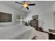 Bedroom boasts hardwood floors, ceiling fan, desk, and dresser at 746 Coral Reef Dr # 746, Tampa, FL 33602