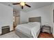 Bedroom boasts hardwood floors, a bed with tufted headboard and ceiling fan at 746 Coral Reef Dr # 746, Tampa, FL 33602