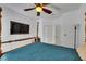 Bedroom boasts hardwood floors, a four-poster bed, and ceiling fan at 746 Coral Reef Dr # 746, Tampa, FL 33602