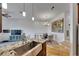 Open concept view of a dining area and kitchen, and the tile flooring with an open view of the living area at 746 Coral Reef Dr # 746, Tampa, FL 33602