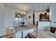 Dining area with stainless steel railings, adjacent to the kitchen; perfect for Gathering dinners at 746 Coral Reef Dr # 746, Tampa, FL 33602
