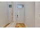 Well-lit entryway with decorative mirror and marble flooring leading into the home at 746 Coral Reef Dr # 746, Tampa, FL 33602