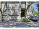 Inviting two-story condo exterior with attached garages, manicured landscaping, and private entrance at 746 Coral Reef Dr # 746, Tampa, FL 33602