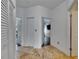 Bright hallway with ceramic floors, white doors and trim, and multiple access points at 746 Coral Reef Dr # 746, Tampa, FL 33602