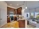 Modern kitchen with stainless steel appliances, granite countertops, and an inviting view of the bright living room at 746 Coral Reef Dr # 746, Tampa, FL 33602