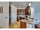Well-equipped kitchen showcasing rich cabinetry, stainless steel appliances, and a granite countertop at 746 Coral Reef Dr # 746, Tampa, FL 33602