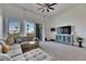 Bright living room with modern furnishings, neutral carpet, and sliding doors to private balcony at 746 Coral Reef Dr # 746, Tampa, FL 33602